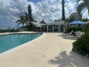 Community resort pool facing LaRoc Bar & Grill