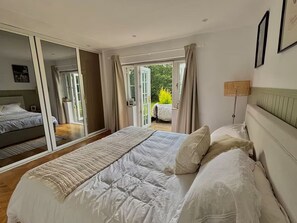 Plentiful storage space in fitted wardrobes for hanging, luggage and drawers.