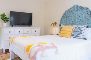 Downstairs bedroom with queen bed and private outdoor entrance