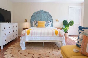 Downstairs bedroom with queen bed and private outdoor entrance