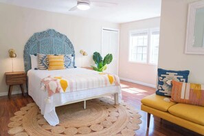 Downstairs bedroom with queen bed and private outdoor entrance