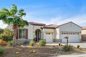 Front of house with golf cart garage 