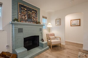 Cozy up by the beautiful fireplace.