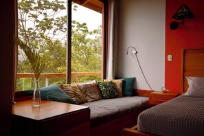 Full day bed /  window seat. Watch the stars at night or the monkeys daytime.