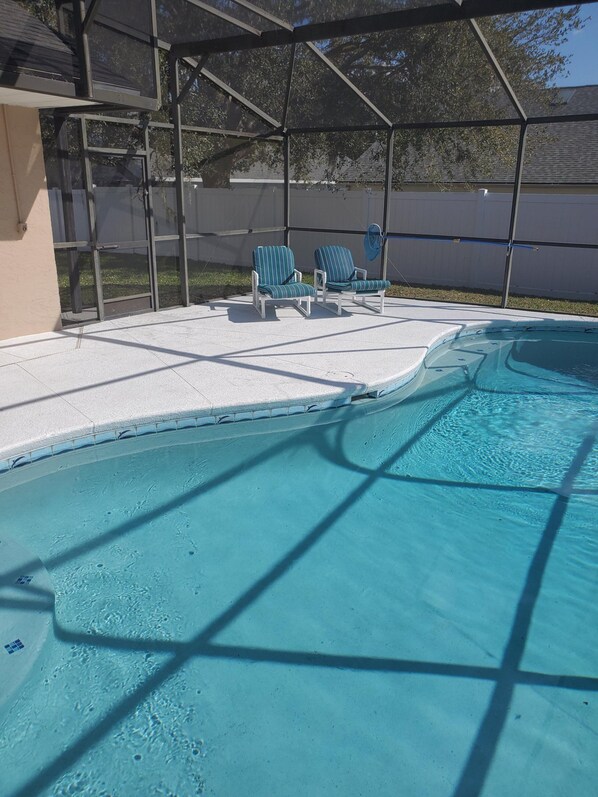 South west facing pool with privacy fence