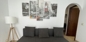Living room with sofa bed and modern New York decor