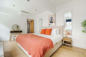 Bedroom 1: super king bed, 50" TV, and full air conditioning for total comfort.