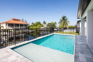 Your morning swim comes with palm views and peaceful skies