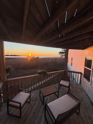 Sunset over Kitty Hawk Bay from your private deck.
