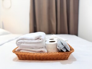 towels, sleep mask, ear plugs, toilet paper