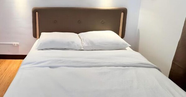 Premium 8 inch mattress with super soft bedding, pillows, and duvet.