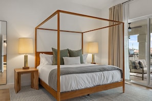Enjoy the luxurious and expansive upstairs primary bedroom suite with a King canopy bed, direct patio with seating areas and a 65" 4K TV!