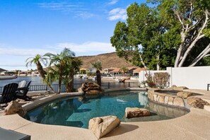 Enjoy the lakefront views from the heated pool and spa with plenty of sun loungers to soak up the sun!