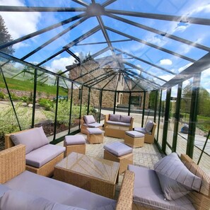 Glass Pavilion with Ambient Evening Lights – Relax Under the Stars