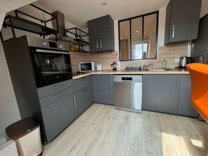 A spacious, bright, and practical kitchen.