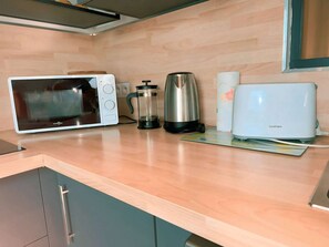 Oven, microwave, kettle, toaster, and coffee machine