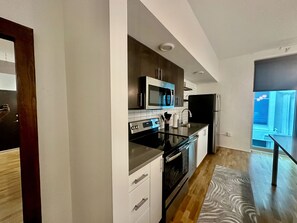 Full kitchen with stainless steel appliances