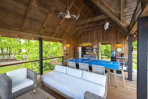 Outdoor living and entertaining space in boathouse