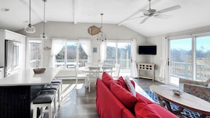 Second floor main living area is open and brigth with a vault ceiling