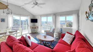 Living room with comfortable seating and water views