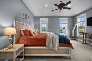 Spacious, sun-filled primary suite with a walk-in closet, oversized bathroom, and direct access to a private hot tub just steps from your back door!