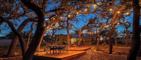 Enjoy meals together under the stars in the enchanting back yard dining area