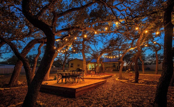 Enjoy meals together under the stars in the enchanting back yard dining area