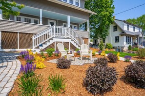 Unwind in the garden breeze from cozy Adirondack chairs.