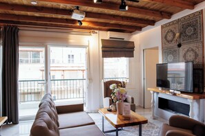 Bright living room with large windows overlooking the city