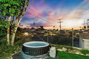 Unwind in the hot tub while enjoying a stunning view.