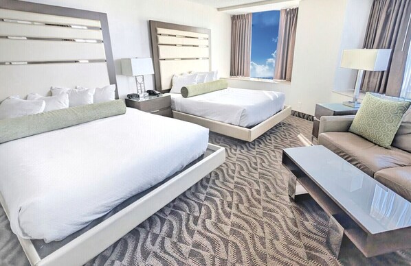 Wake up in two queen-size beds with luxurious, cushioned pillows and a sofa bed!
