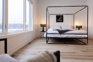 Spacious primary bedroom with a king bed and serene vibes