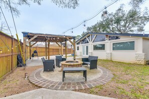 Back Exterior | Fenced Yard | Gas Fire Pit | Charcoal Grill | Single-Story Home