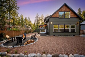 Our charming cabin is nestled in the peaceful setting of the Nisqually Valley. It features a cozy outdoor space designed for relaxation and gathering. 