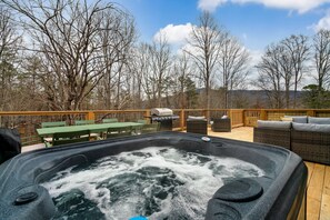 Relax in the hot tub on the expansive deck