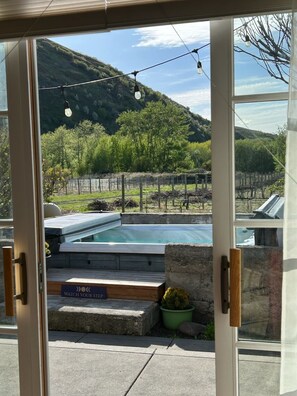 Large swim size jacuzzi & patio outside the sliding doors of your Suite