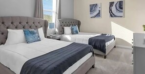 Bedroom #3 – Two full beds, TV and shared bathroom for a relaxing stay.