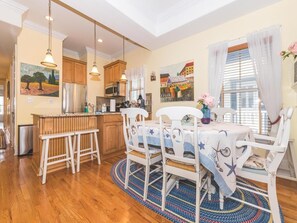 Bright dining space with coastal decor perfect for gathering.
