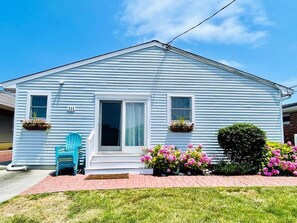 A cozy retreat with a beautifully maintained exterior, just steps from the beach.