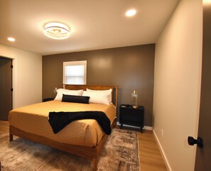 Master bedroom with an ensuite bathroom.  
