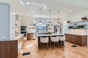 The open-concept dining area flows seamlessly from the kitchen, making group meals a breeze.