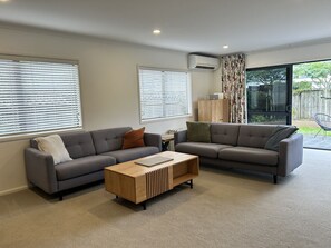 Comfortable Lounge Area Opening Outdoors