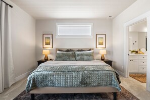 Experience unparalleled comfort in the primary bedroom, where a king-sized bed with a sumptuous mattress and luxurious bedding invites you to unwind.