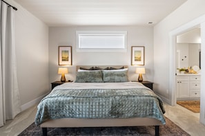 Experience unparalleled comfort in the primary bedroom, where a king-sized bed with a sumptuous mattress and luxurious bedding invites you to unwind.