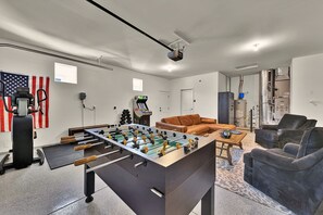 Endless entertainment awaits in the game room! Challenge friends to a round of foosball, enjoy classic arcade games, or break a sweat in the workout space.  Sink into the cozy seating area and catch the game or your favorite shows on the 65” smart TV.