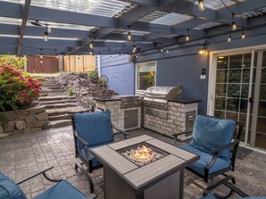 Relax at the fire table under a covered private patio or fire up the grill! 