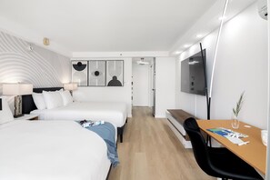 Relax in your studio with 2 queen-sized beds and 65" Smart TV