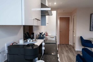 Cook up a storm in the fully equipped kitchen with modern appliances and all the essentials for dining in or enjoying takeaway.