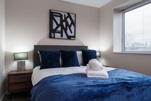Drift off to sleep in the comfortable double bedroom, complete with soft linens, ample storage, and a calming ambiance.