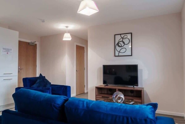 Kick back in the modern living room, fully equipped with Sky TV!